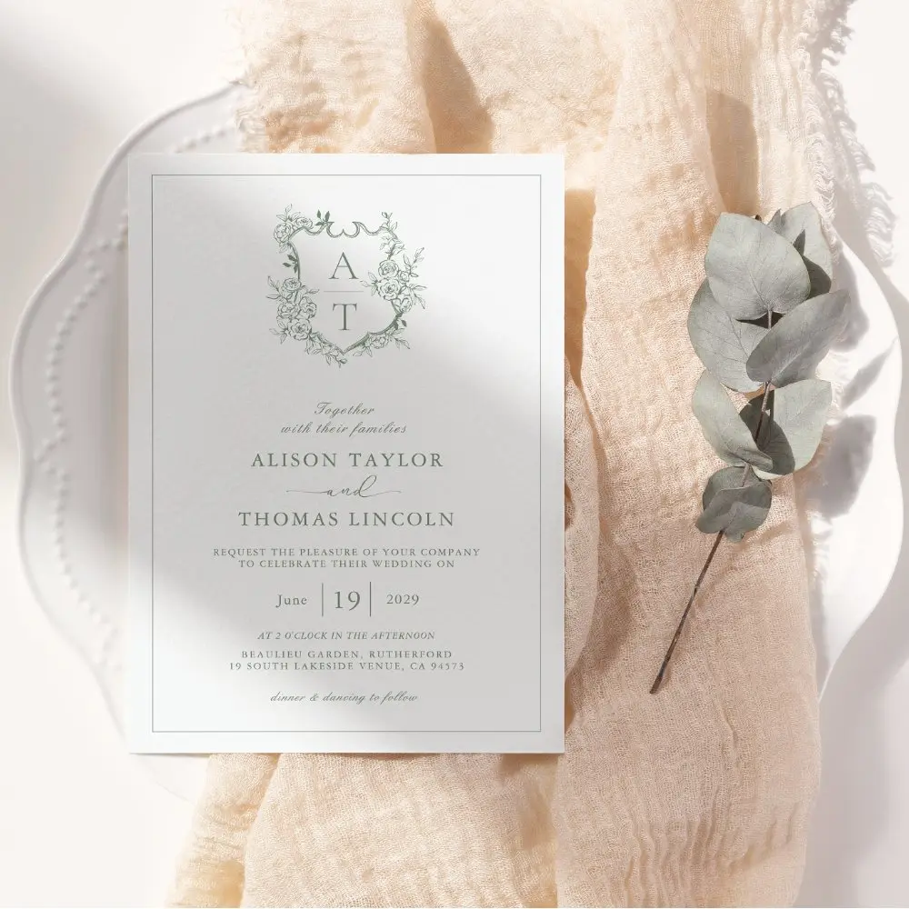 formal_crest_sage_green_monogram_wedding_invitation-r_vsawos_1000.webp